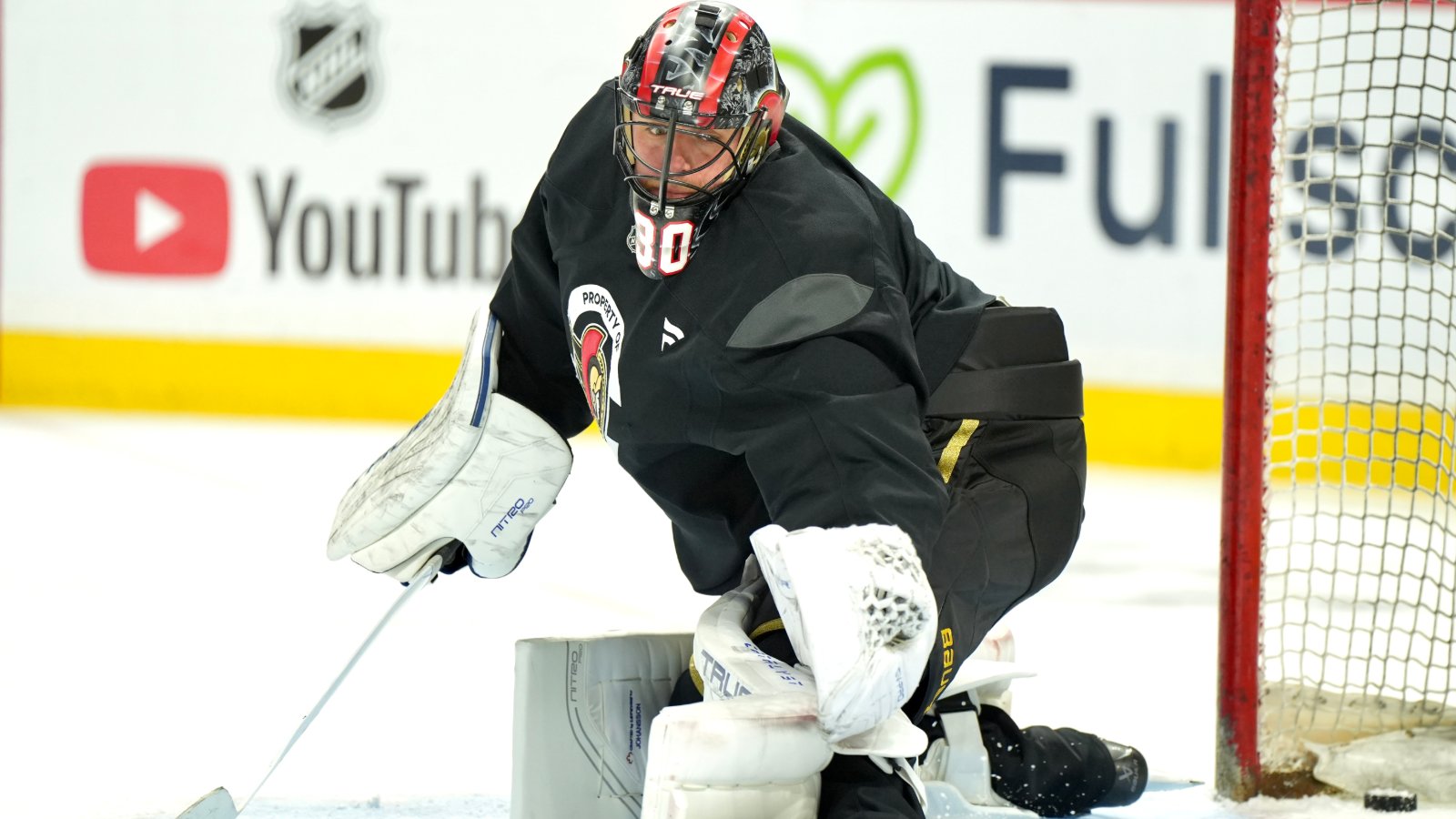 Jonas Johnasson makes a save during Ottawa Senators practice at the Canadian Tire Centre.